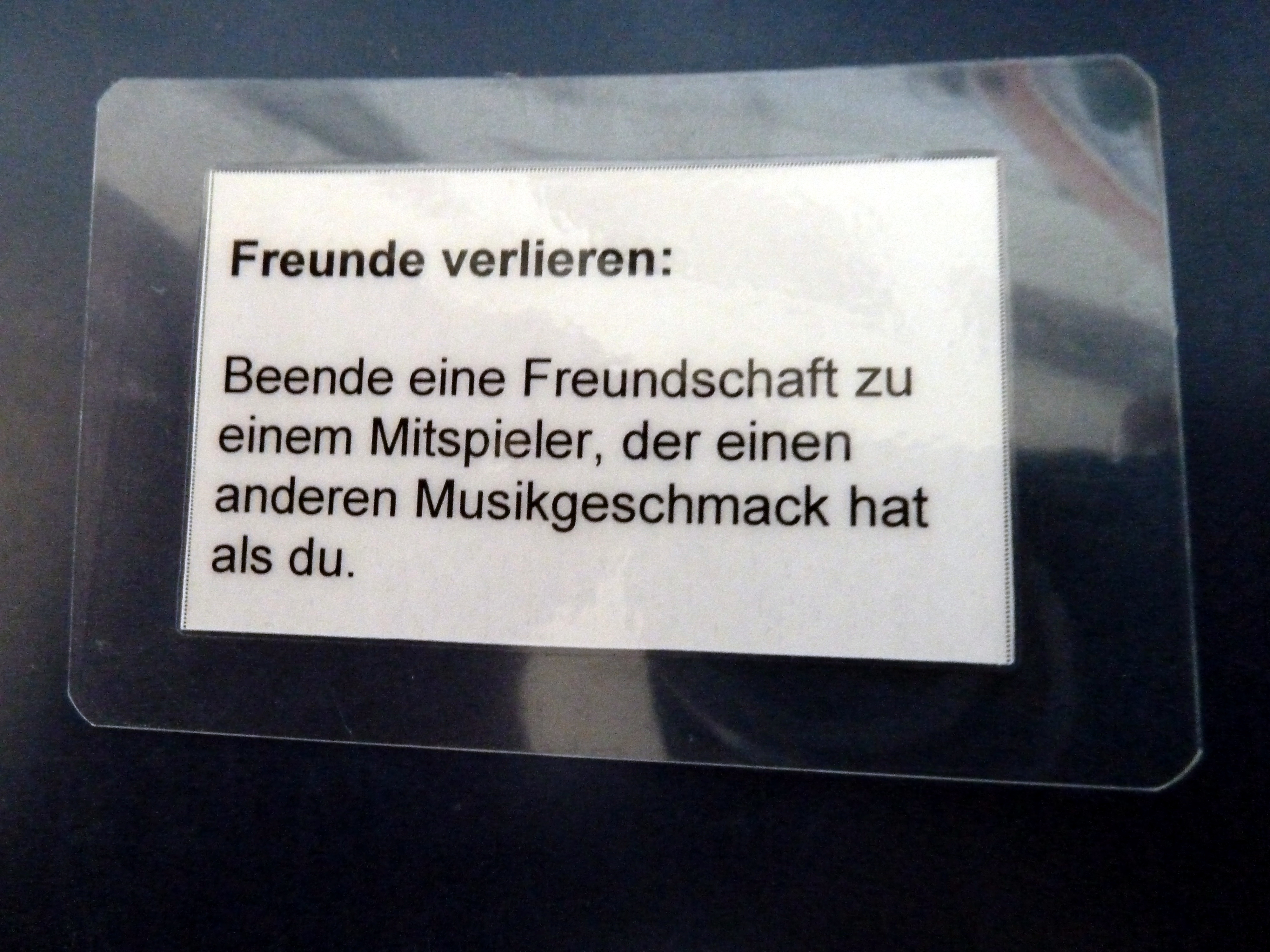 Aktionskarte mit dem Text: Freunde verlieren: Beende eine Freundschaft zu einem anderen Mitspieler, der einen anderen Musikgeschmack hat.